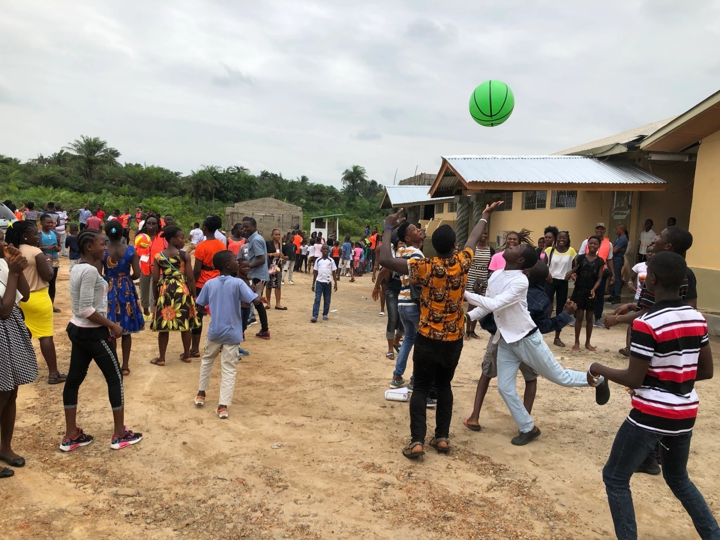 Young people playing basketball at MTSP’s Liberia camp